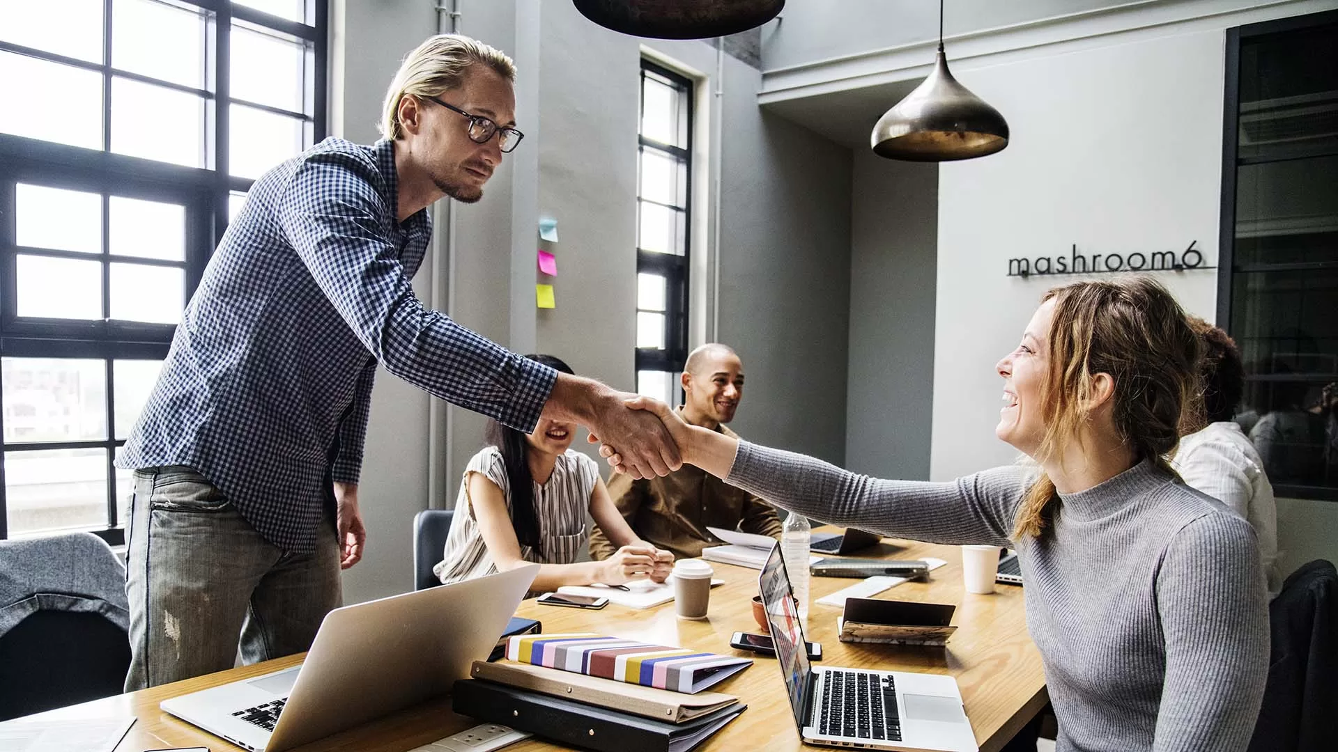 business people shaking hands in agreement